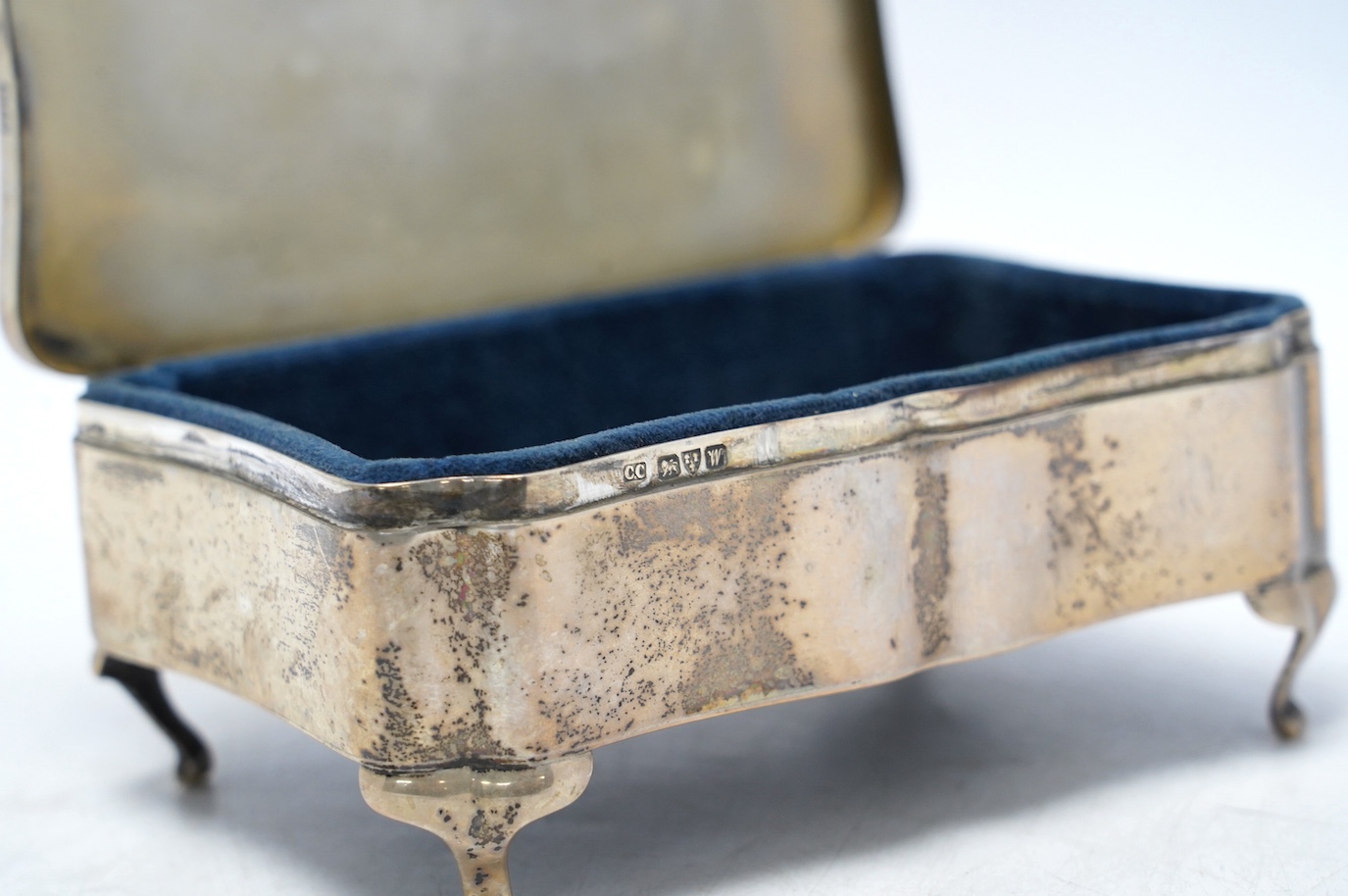 A George V silver mounted rectangular trinket box, by Colen Hewer Cheshire, Chester, 1922, 14cm. Condition - fair to poor